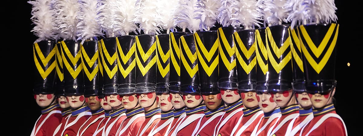 Radio City Rockettes stand in toy soldier costumes at Radio City Music Hall