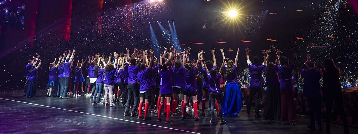 Kids celebrating during annual Garden of Dreams Foundation talent show at Radio City Music Hall