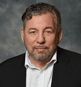 Professional headshot of James Dolan, Executive Chairman and CEO of Madison Square Garden Entertainment