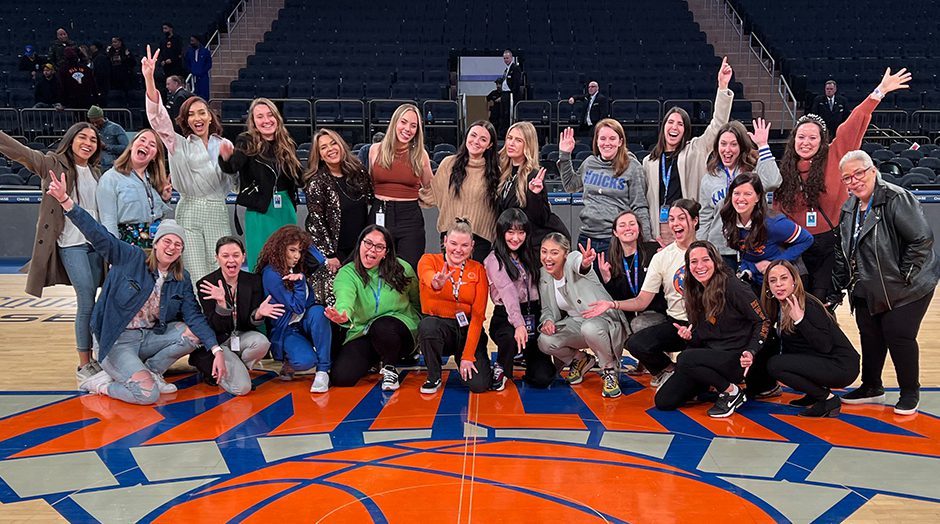 Madison Square Garden Entertainment employees posing for photo on New York Knicks court